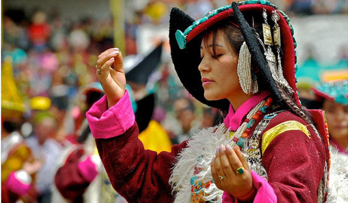 A Ladakhi woman performing a traditional dance